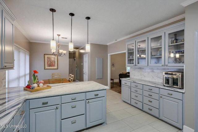 138 Oak Ridge Cir, Madison, MS 39110 - kitchen featuring a peninsula, gray cabinets, a chandelier, pendant lighting, and glass insert cabinets
