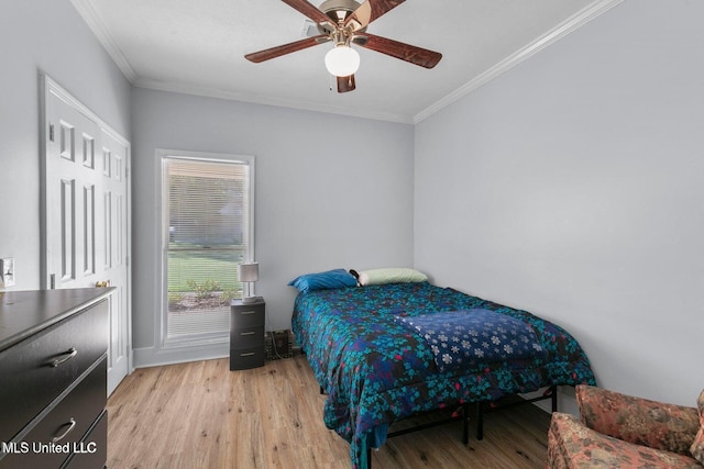 138 Oak Ridge Cir, Madison, MS 39110 - bedroom featuring ornamental molding, light wood-style flooring, ceiling fan, and baseboards
