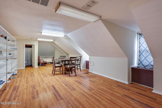 138 Oak Ridge Cir, Madison, MS 39110 - additional living space with wood finished floors, lofted ceiling, and baseboards