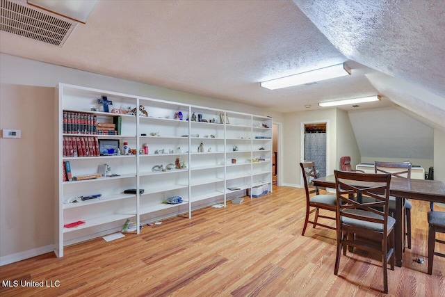 138 Oak Ridge Cir, Madison, MS 39110 - dining space featuring wood finished floors, a textured ceiling, and baseboards