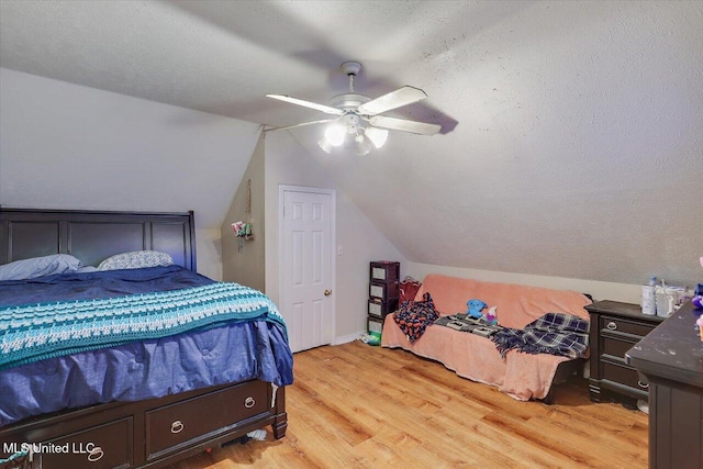 138 Oak Ridge Cir, Madison, MS 39110 - bedroom featuring light wood-style flooring, lofted ceiling, and ceiling fan