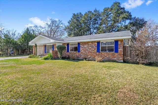 ranch-style home featuring a front yard