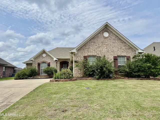 341 Austin Cir, Brandon, MS 39047 - view of front of home featuring brick siding, a front yard, and driveway