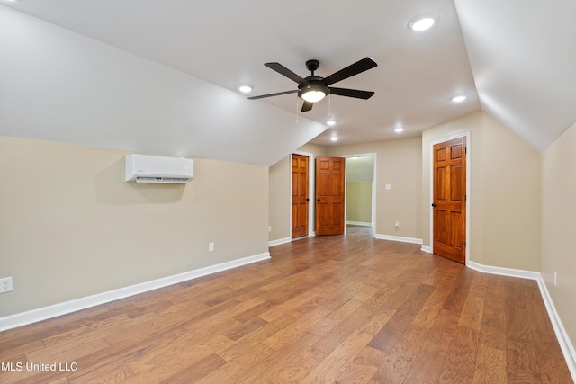 241 Cowtown Rd, Senatobia, MS 38668 - bonus room featuring a wall mounted AC, vaulted ceiling, a ceiling fan, recessed lighting, and light wood-type flooring