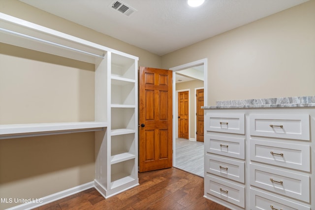 241 Cowtown Rd, Senatobia, MS 38668 - spacious closet featuring dark wood-style flooring