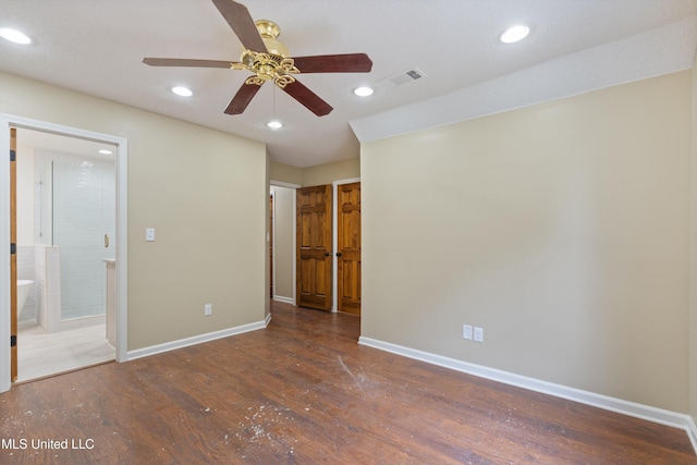 241 Cowtown Rd, Senatobia, MS 38668 - unfurnished bedroom with wood finished floors, recessed lighting, and ensuite bath