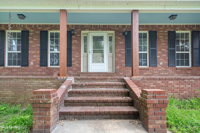 241 Cowtown Rd, Senatobia, MS 38668 - entrance to property featuring brick siding and a porch