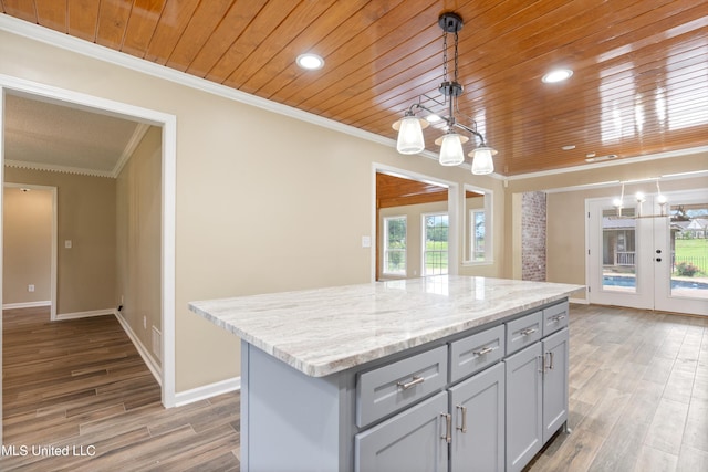 241 Cowtown Rd, Senatobia, MS 38668 - kitchen with wood ceiling, gray cabinets, crown molding, decorative light fixtures, and a kitchen island