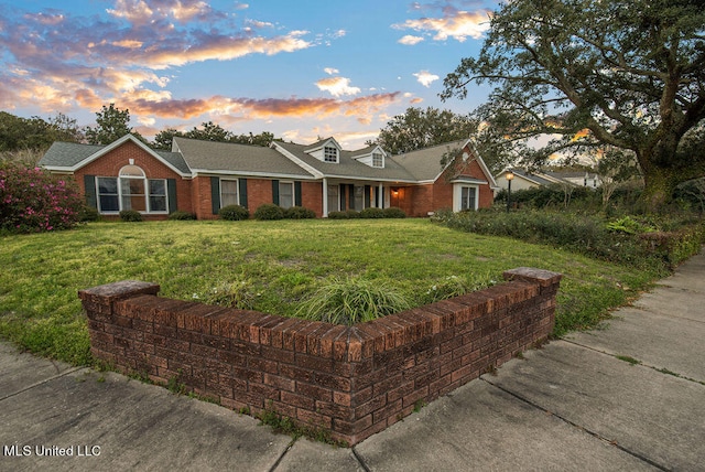 view of front of property with a lawn