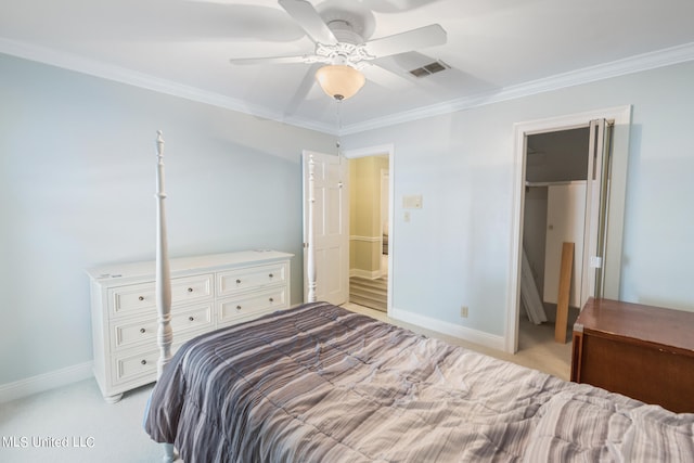 bedroom featuring crown molding, light carpet, and ceiling fan