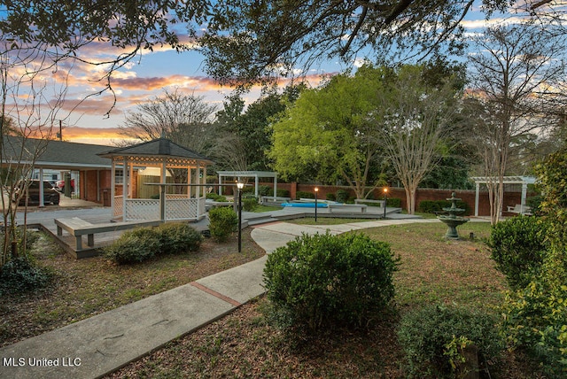 view of community featuring a gazebo and a swimming pool