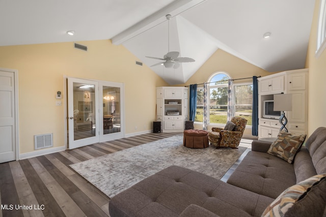 living room featuring dark wood-type flooring, high vaulted ceiling, and ceiling fan