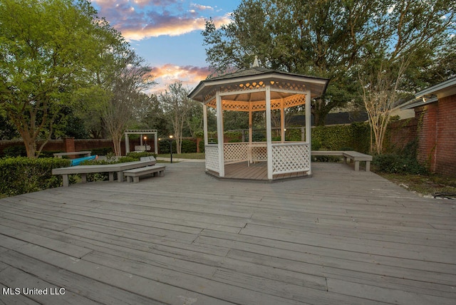 deck at dusk with a gazebo