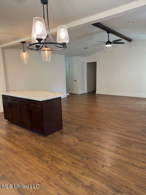 kitchen with hanging light fixtures, dark hardwood / wood-style flooring, lofted ceiling with beams, and ceiling fan with notable chandelier