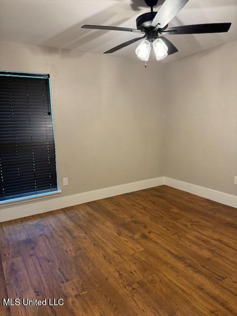 spare room featuring ceiling fan and wood-type flooring