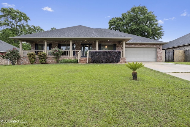 13239 Tyler Ln, Gulfport, MS 39503 - view of front of home with covered porch, brick siding, an attached garage, concrete driveway, and roof with shingles