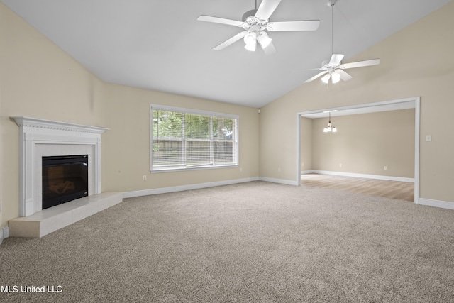 13239 Tyler Ln, Gulfport, MS 39503 - unfurnished living room featuring carpet floors, a tile fireplace, vaulted ceiling, baseboards, and a ceiling fan