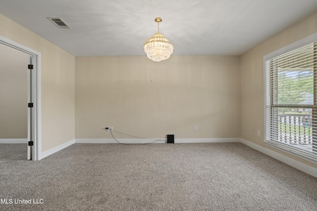 13239 Tyler Ln, Gulfport, MS 39503 - carpeted spare room with a chandelier and baseboards