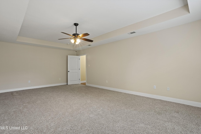 13239 Tyler Ln, Gulfport, MS 39503 - carpeted empty room with a raised ceiling, a ceiling fan, and baseboards