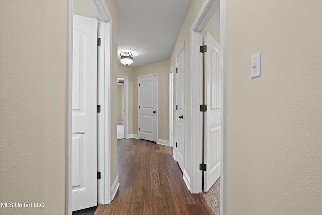 13239 Tyler Ln, Gulfport, MS 39503 - hallway with dark wood-style flooring and baseboards