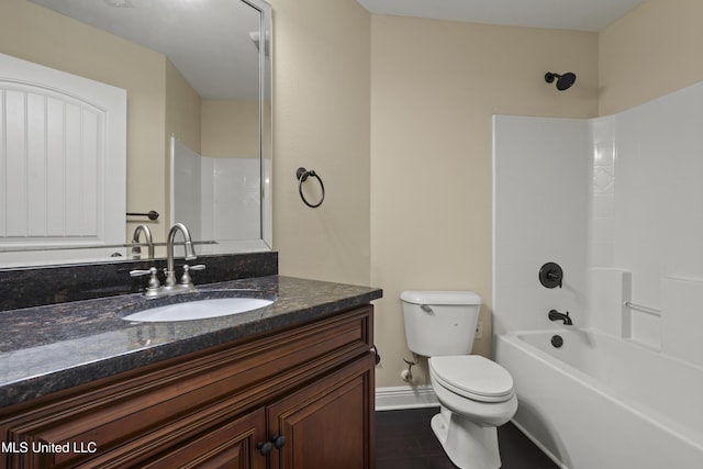 13239 Tyler Ln, Gulfport, MS 39503 - full bath with toilet, vanity, baseboards, wood finished floors, and bathtub / shower combination