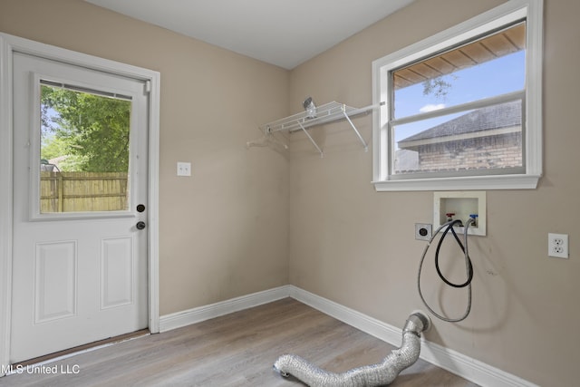 13239 Tyler Ln, Gulfport, MS 39503 - laundry room with hookup for an electric dryer, washer hookup, baseboards, and wood finished floors