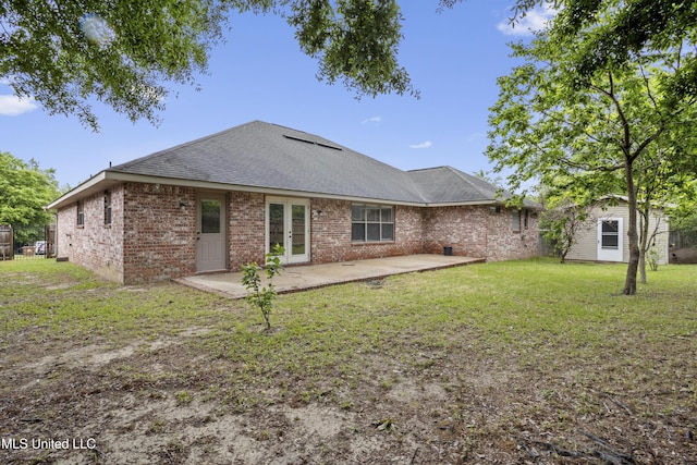 13239 Tyler Ln, Gulfport, MS 39503 - back of house featuring french doors, a patio, a yard, an outdoor structure, and brick siding