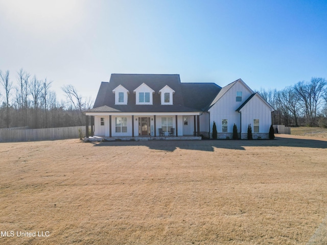 view of front of home featuring a front yard and a porch