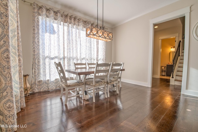 dining room with dark hardwood / wood-style floors