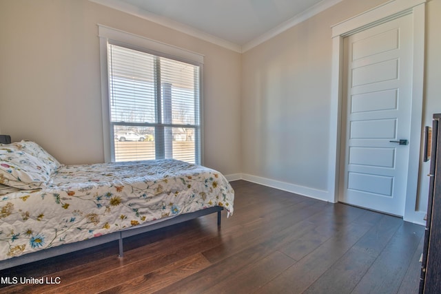 bedroom with dark wood-type flooring and ornamental molding