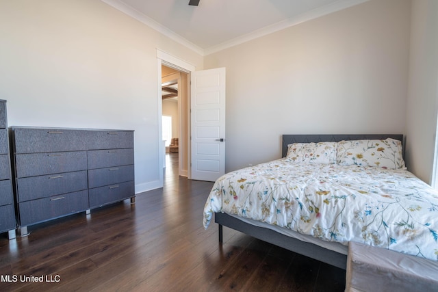 bedroom featuring ceiling fan, dark wood-type flooring, and crown molding