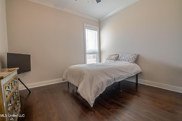 bedroom featuring ceiling fan, dark wood-type flooring, and ornamental molding