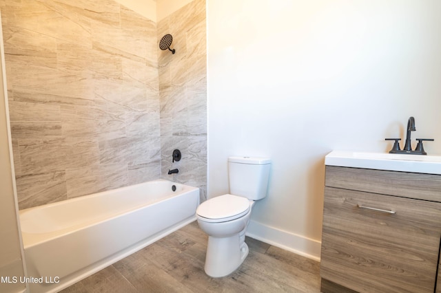 full bathroom featuring vanity, toilet, tiled shower / bath combo, and wood-type flooring