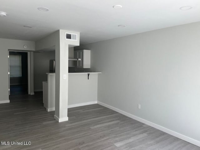 unfurnished living room with hardwood / wood-style flooring