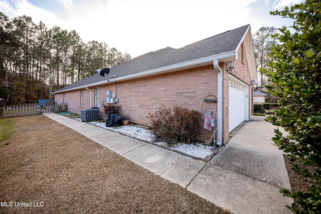 view of side of home featuring cooling unit