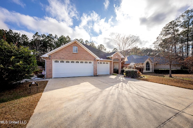 ranch-style home featuring a garage