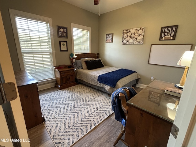 bedroom with hardwood / wood-style floors and ceiling fan