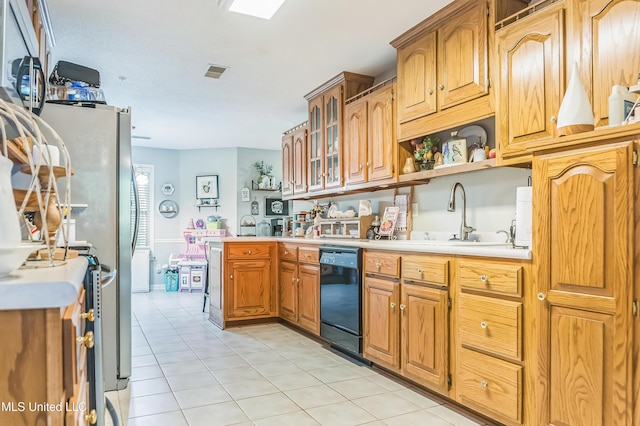 kitchen with dishwasher, a sink, light tile patterned flooring, light countertops, and a peninsula