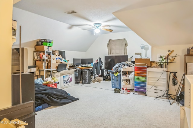 bonus room featuring carpet, ceiling fan, vaulted ceiling, and an office area