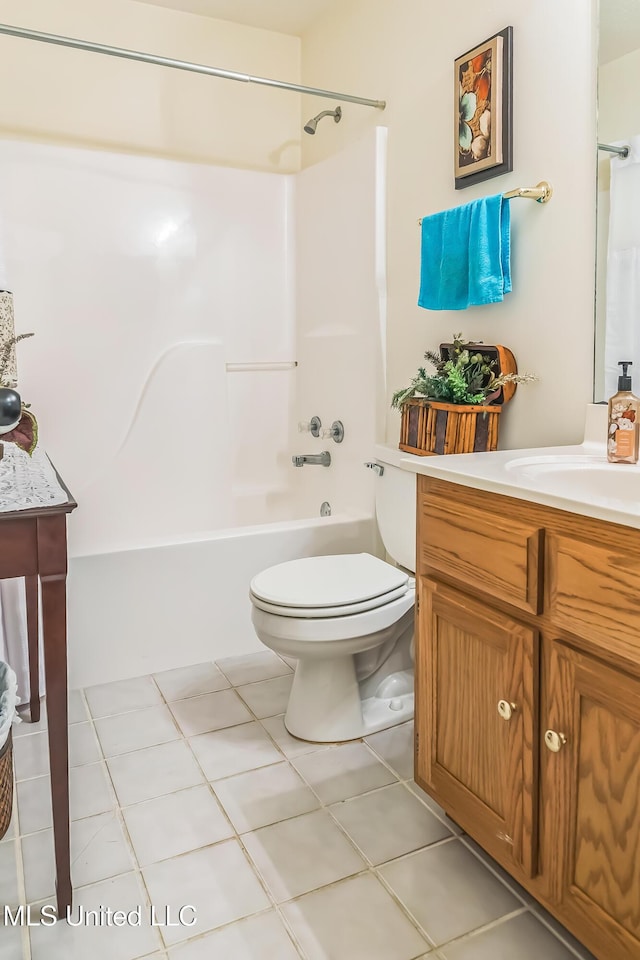 bathroom featuring vanity, toilet, bathtub / shower combination, and tile patterned floors