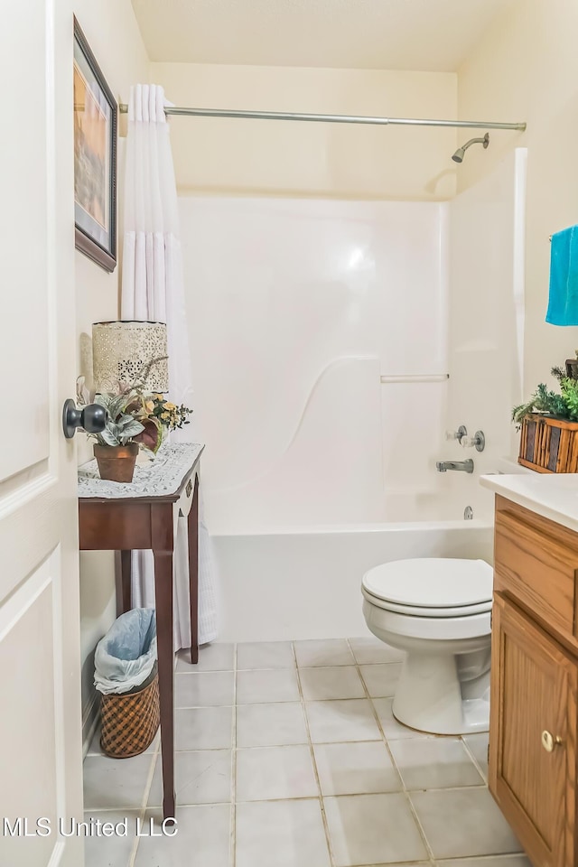 full bathroom with shower / bathtub combination, toilet, tile patterned flooring, and vanity