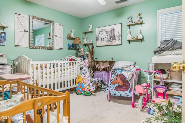 carpeted bedroom with a ceiling fan