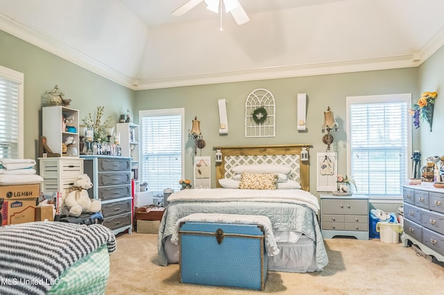 bedroom with carpet flooring, lofted ceiling, ornamental molding, and ceiling fan
