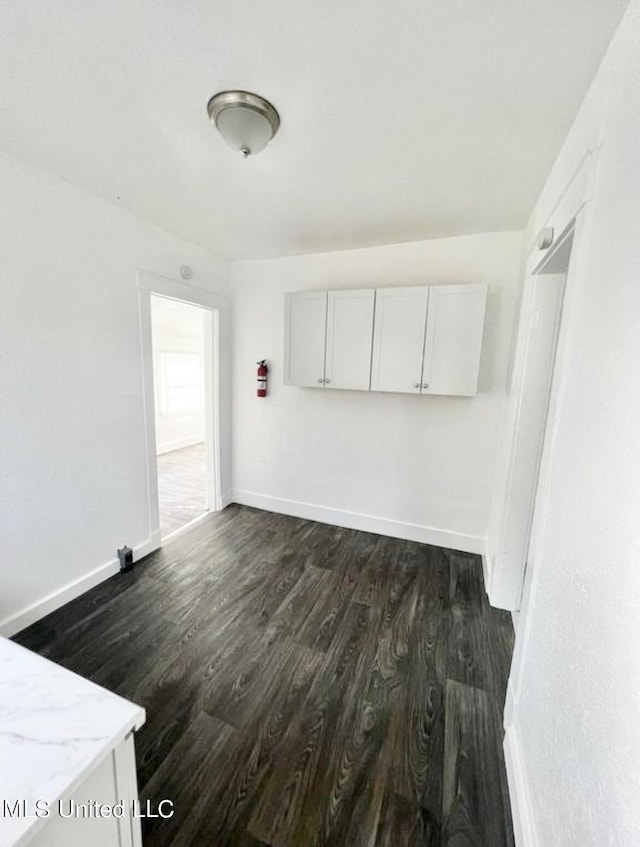 128 Carolyn Ave, Jackson, MS 39209 - spare room featuring dark wood-style floors and baseboards