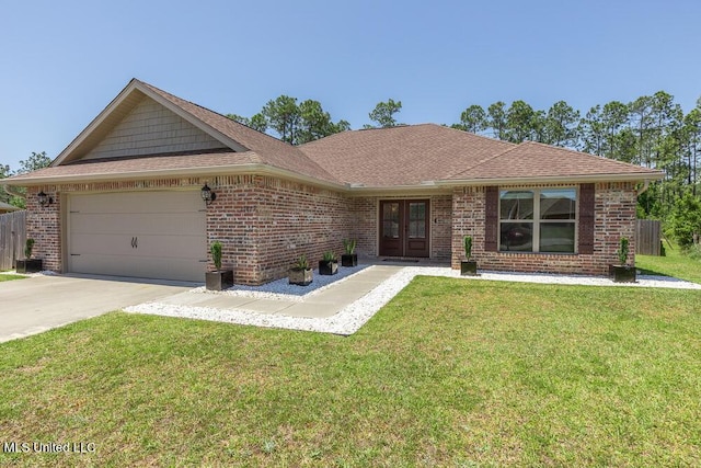 21829 Hunters Cv, Gulfport, MS 39503 - ranch-style house featuring french doors, a garage, brick siding, driveway, and roof with shingles