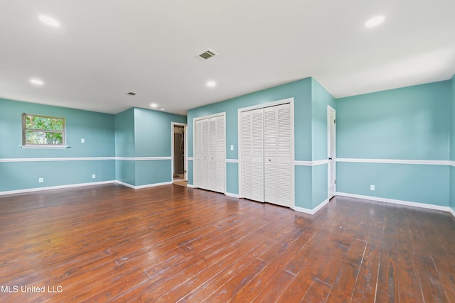 120 Clower Ave, Long Beach, MS 39560 - unfurnished bedroom with multiple closets, hardwood / wood-style floors, and recessed lighting