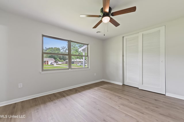 120 Clower Ave, Long Beach, MS 39560 - unfurnished bedroom featuring wood finished floors, a closet, and a ceiling fan