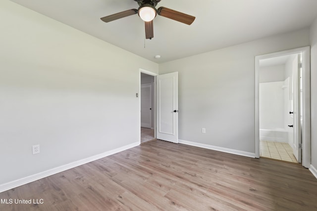 120 Clower Ave, Long Beach, MS 39560 - unfurnished bedroom featuring wood finished floors, ensuite bathroom, and a ceiling fan