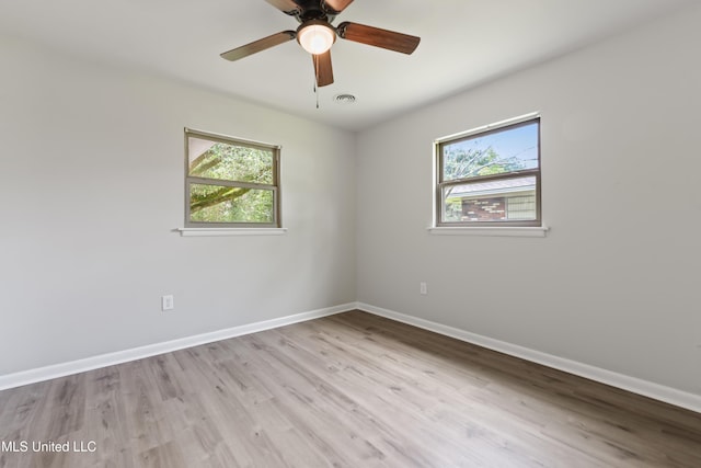 120 Clower Ave, Long Beach, MS 39560 - unfurnished room featuring healthy amount of natural light, wood finished floors, and ceiling fan