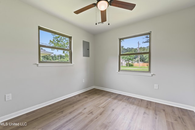 120 Clower Ave, Long Beach, MS 39560 - unfurnished room featuring plenty of natural light, wood finished floors, electric panel, and ceiling fan